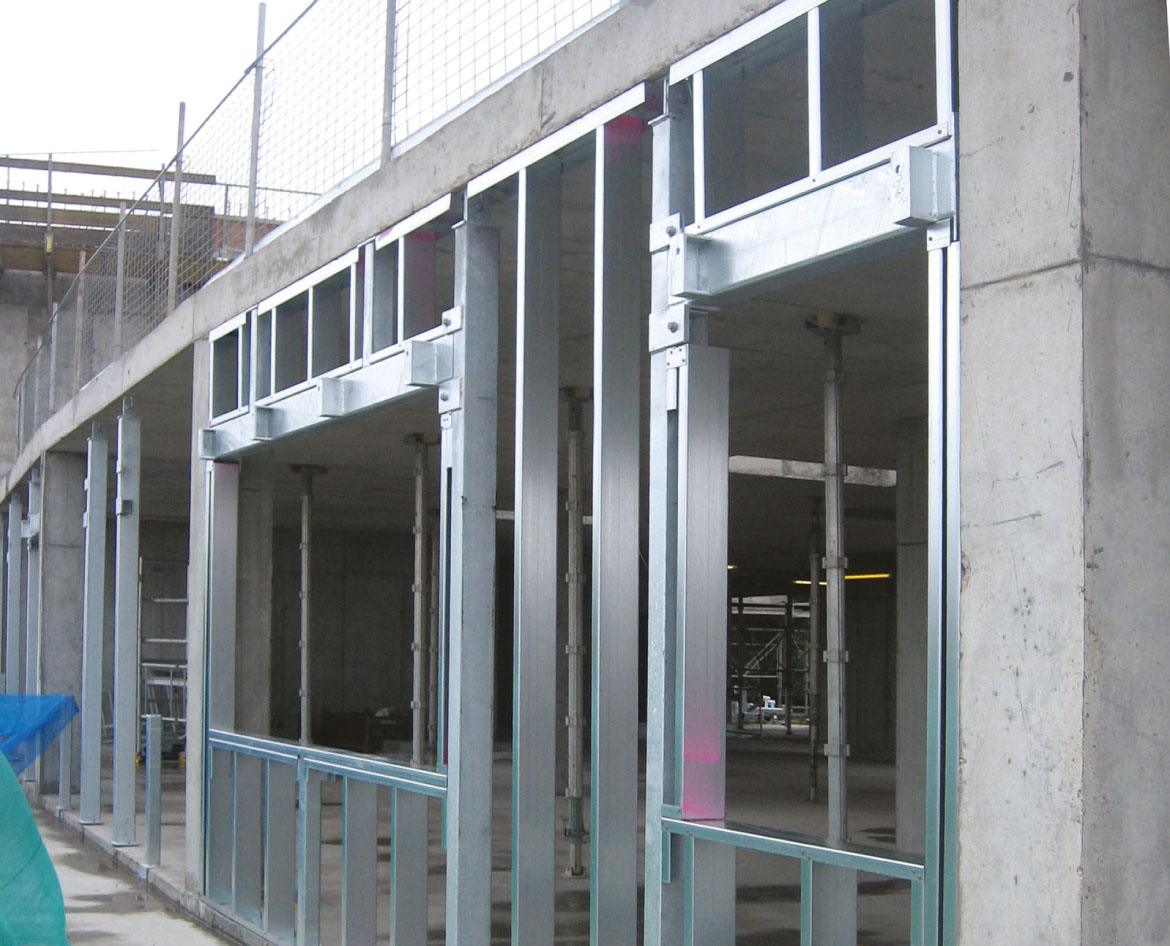 Typical window with secondary wind posts and compound C sections, and brackets to support the canopies