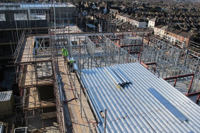 Profiled steel decking prior to installation of rebar/reinforcement and in-situ concrete. Hot rolled steel 'goal posts' designed and manufactured by Metek.